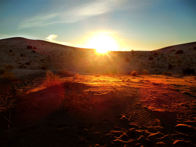 Sun behind the dunes